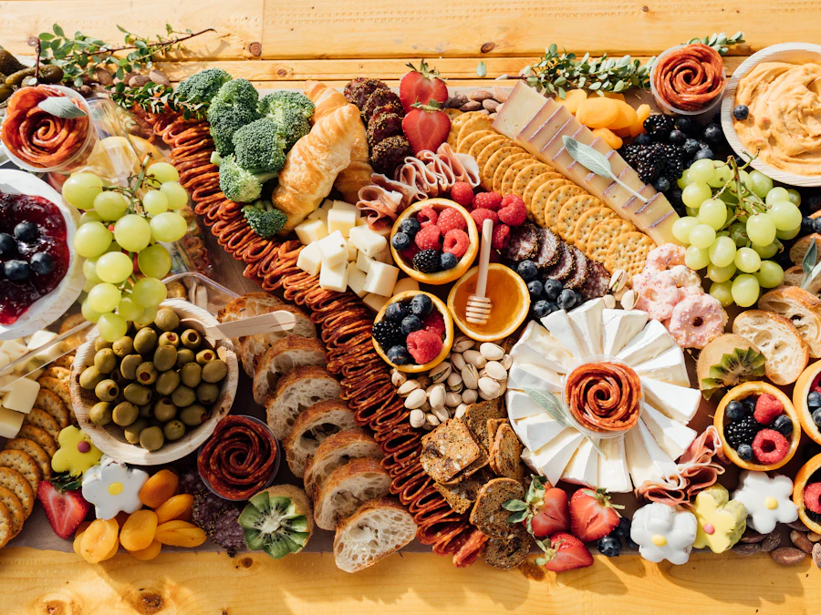 A generous charcuterie board with cheeses, fruit, and crackers