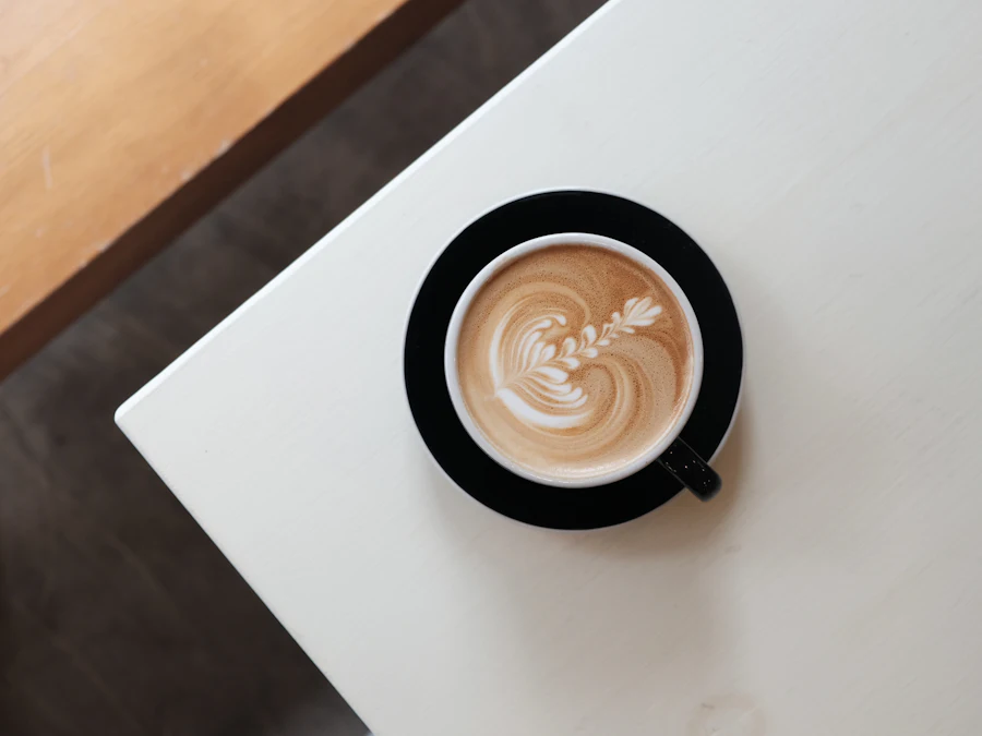 A latte with latte art on a white table